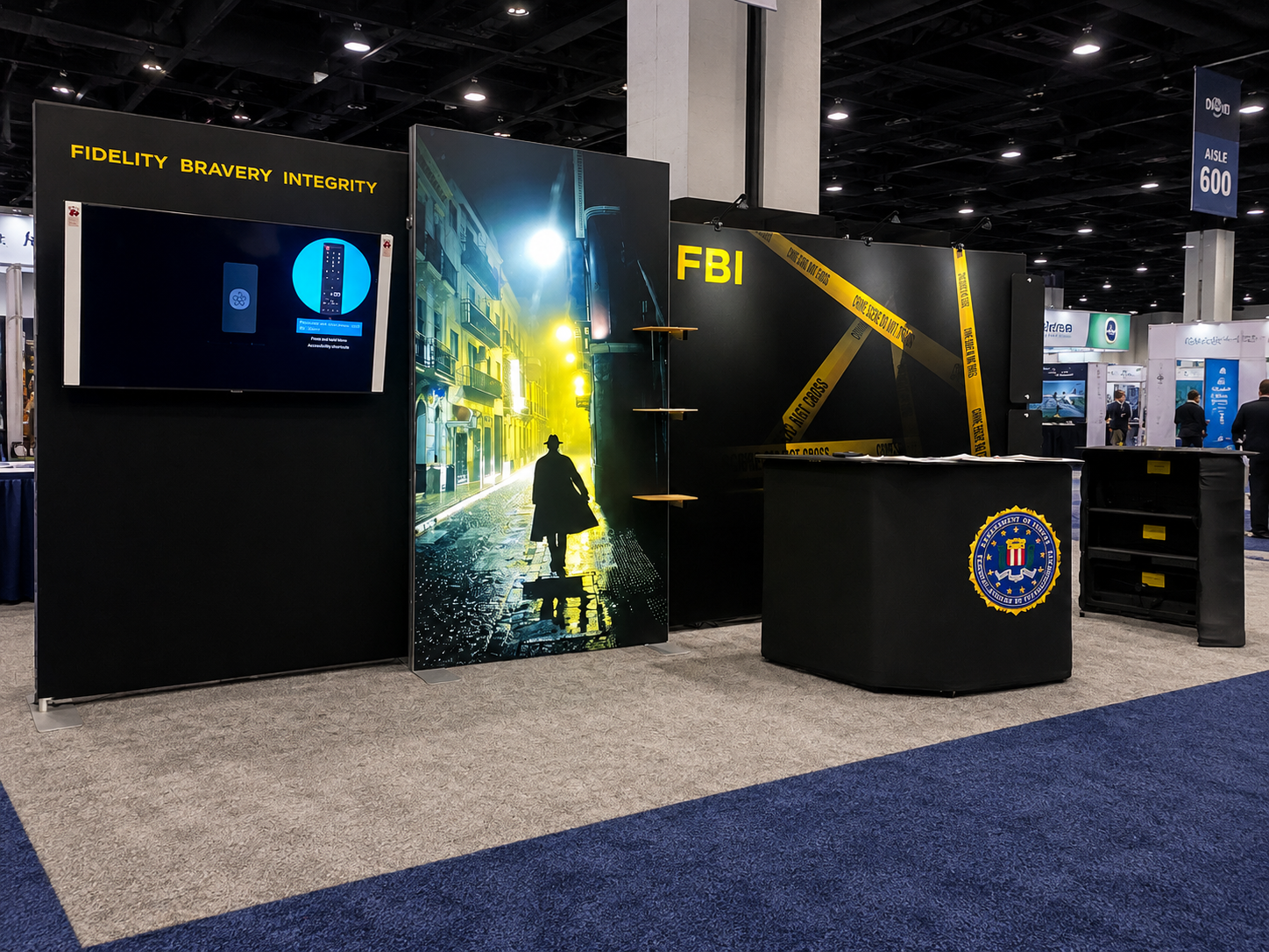 10x20 ieLITE booth build on the show floor — backwall, lightbox, counter, and monitor mount